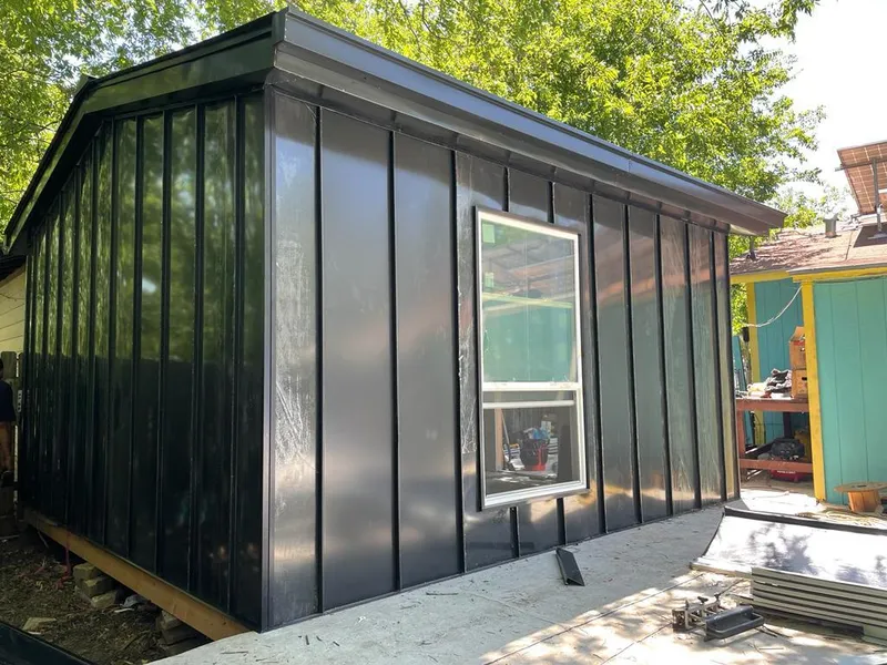 Black standing seam metal wall panels for Roof Inspection in Porters Neck